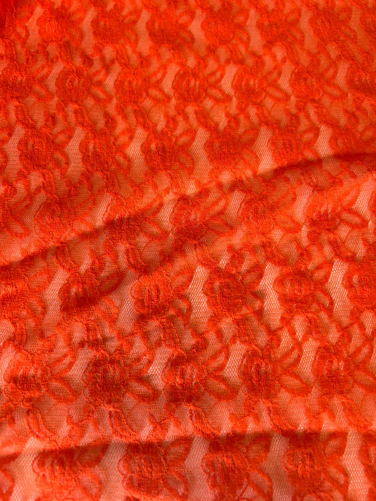 Pizzo elasticizzato disegno fiore piccolo astratto arancio fluo 2 Pizzo elasticizzato disegno fiore piccolo astratto arancio fluo - immagine 2