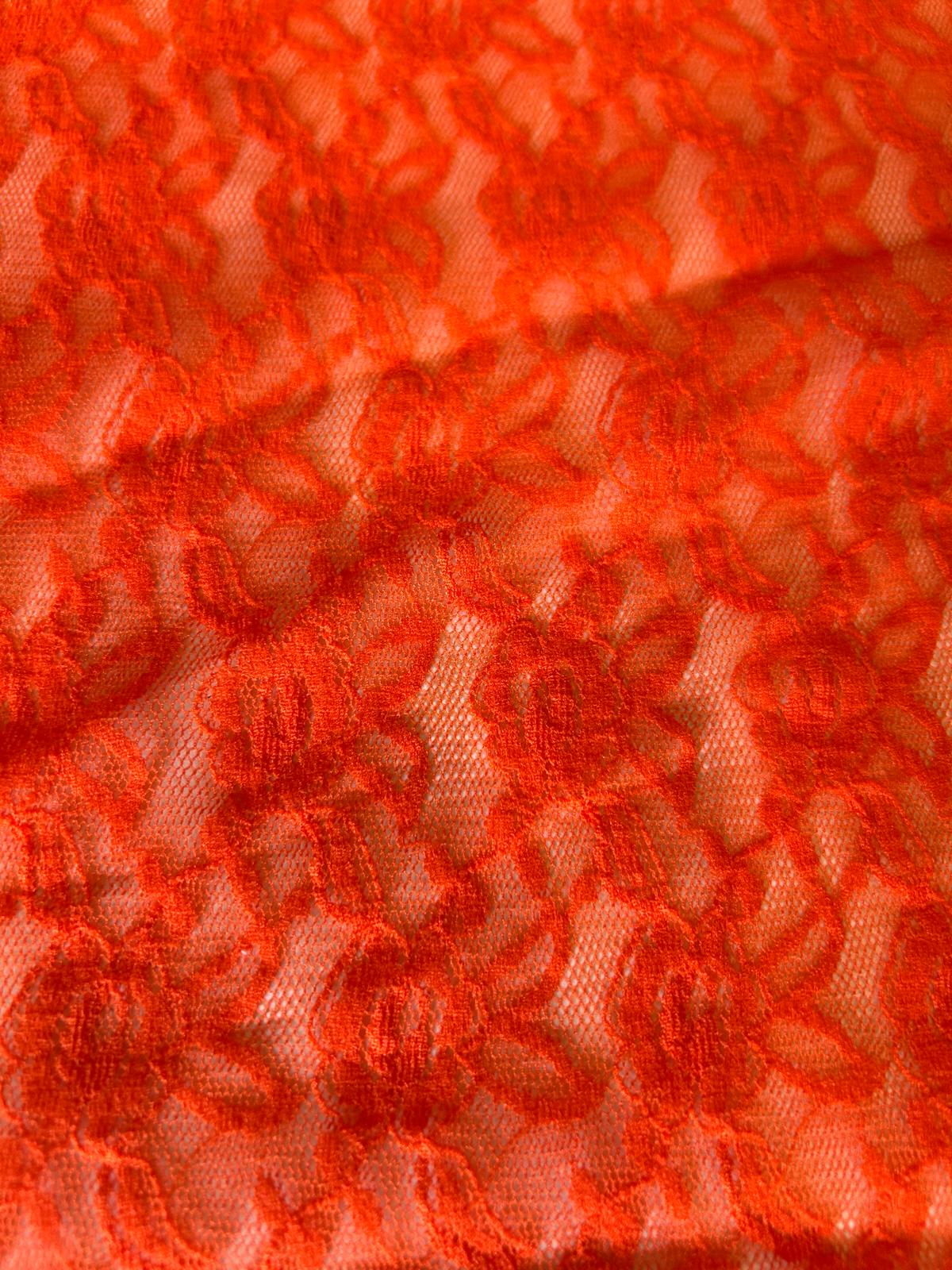 Pizzo elasticizzato disegno fiore piccolo astratto arancio fluo 1 fiore piccolo astratto arancio fluo